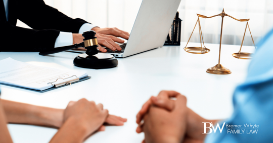 Image of attorney and couple sitting at table