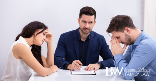 Unhappy couple meeting with arbitrator